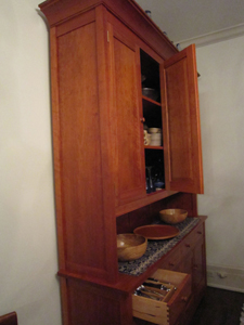 Shaker-style detailing in doors of hutch built by Welch Millwork and Design